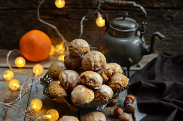 Stack of gingerbreads in a rustic bowl on a wooden background