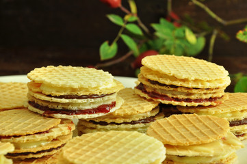 Small round wafers layered with jam and chocolate