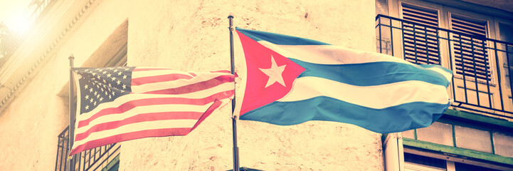 US and Cuban flags side by side in Havana, Cuba