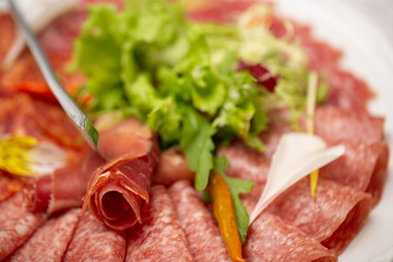 Cold smoked meat plate with pork chops, prosciutto, salami