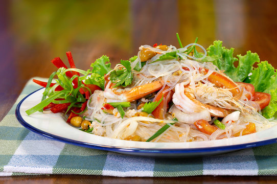 Fresh shrimp spicy salad with vermicelli, thai food delicious in white dish