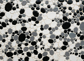 Black and white ceramic mosaic texture, abstract background.