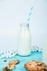 Cookie chocolate with a milk bottles.