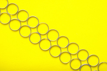 two rows of metal rings for key fobs with keys