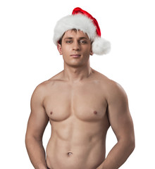 portrait of naked muscular man weared santa cap isolated