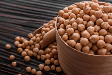 uncooked chickpeas on a wooden rustic background