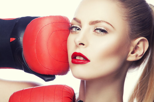 Model girl face with boxing gloves and beauty bright make-up