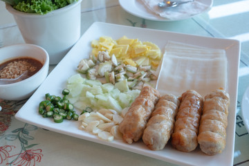 Vietnamese meatball. pork sausage grilled with vegetables and suace