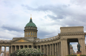 Fototapeta na wymiar Kazan Cathedral (Cathedral of Our Lady of Kazan) in Saint Petersburg, Russia. Orthodox Cathedral and Museum, Famous Cultural Old City Landmark, on Gloomy Cloudy Background with Empty Sky Copy Space.