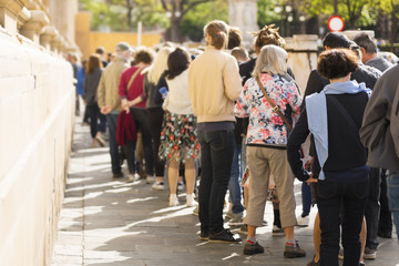 people  queue in line , selective focus