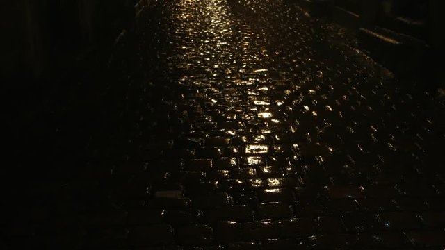 Rain on the a cobblestones in the street of the old city