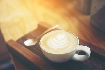 Cup of coffee latte in coffee shop