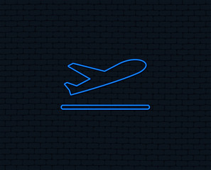 Neon light. Plane takeoff icon. Airplane transport symbol. Glowing graphic design. Brick wall. Vector