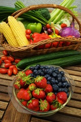 Organic  fruits and vegetables on a wooden table 