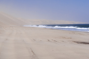 Dunes on the Skeleton Coast / Sandstorm on the Skeleton Coast, dunes to the Atlantic Ocean, Namib Desert, Namibia, Africa.