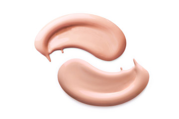 Makeup foundation cosmetic smear cream isolated on white background. Light beige liquid foundation sample smear