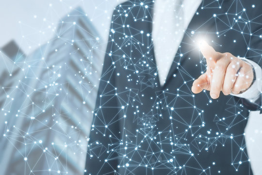 Businessman on blurred skybuilding background using flying network connection