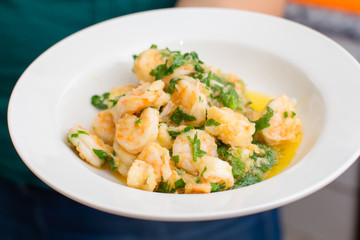 Fototapeta na wymiar boiled shrimps with oil and greens