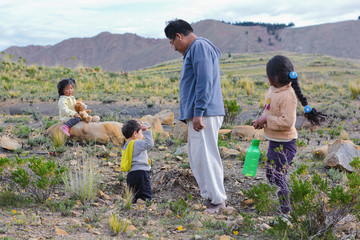 Native american dad with his three children in the countryside.