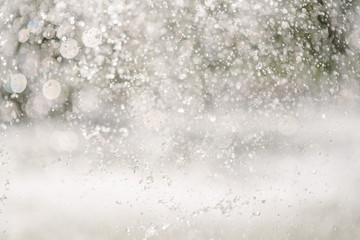 Flow of water fountain. Water splash in a fountain, abstract image.