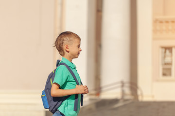 Cute child with rucksack go to school. Boy with backpak.