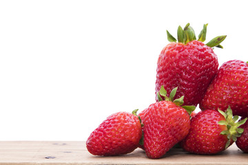 natural red strawberries in wood isolated in white background