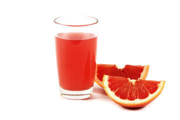 Fresh grapefruit juice with mint in a glass cup isolated on white background. Grapefruit fresh and juice on a white background, view of the shu, cospore space