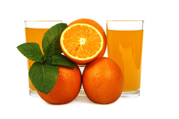 Fresh orange juice with mint in a glass cup isolated on white background. Fresh oranges and juice on a white background, view of the shu, cospore space.