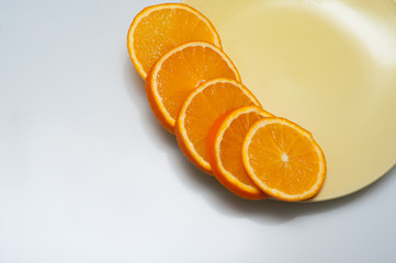 orange slices spread on a plate