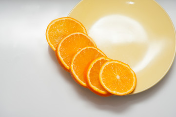 orange slices spread on a plate