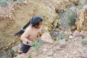 Active little native ammerican girl in the countryside. 