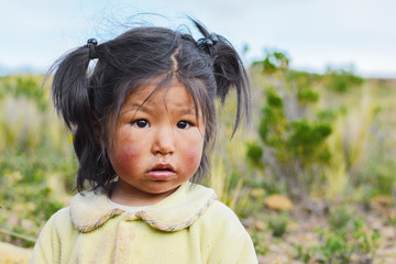 Little dirty native american girl in the countryside. 