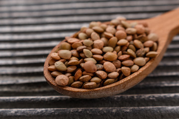 raw lentils on a wooden rustic background