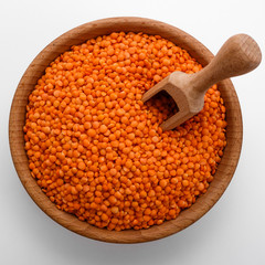 raw lentils on a white acrylic background