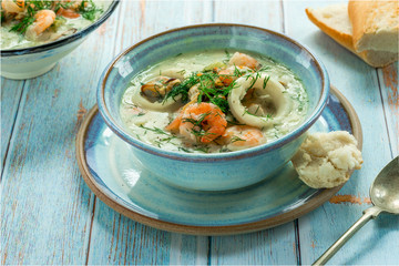 Creamy seafood stew garnished with fresh dill