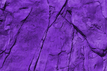 Old wall with cracks texture toning in ultra violet.