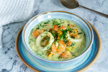 Creamy seafood stew garnished with fresh dill