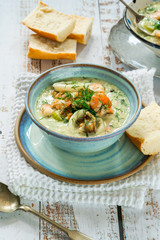 Creamy seafood stew garnished with fresh dill