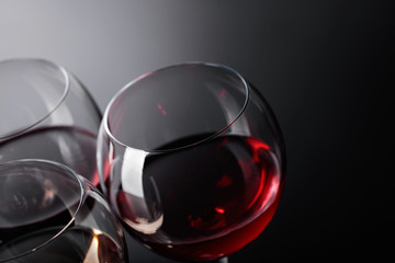 Glasses of  pink , red and white wine .