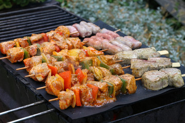 Meat with vegetables grilled on a grill