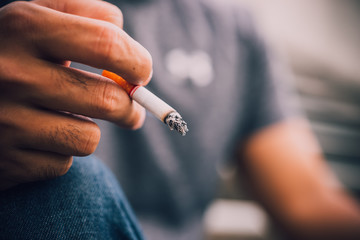 Asian stress handsome man smoking,Thailand people,Depressed man concept,He worry about work of company © reewungjunerr