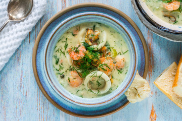 Creamy seafood stew garnished with fresh dill