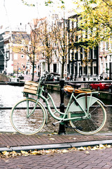 Fototapeta na wymiar Bicycle on Amsterdam Canal Bridge
