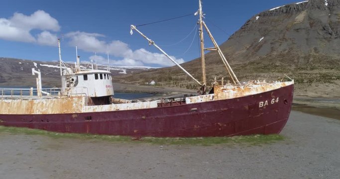Long aerial panning shot of Gardar shipwreck, West fjords Iceland.
