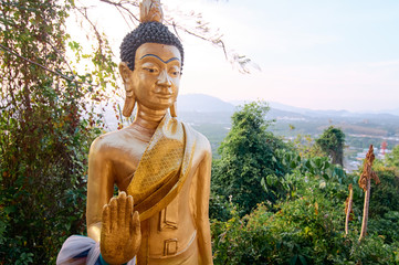 Golden statues of buddha in thai temple.
