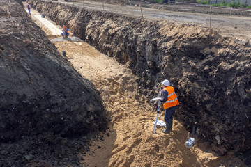 the worker is building a trench