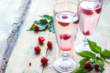 White wine with fresh raspberries. raspberry cocktail