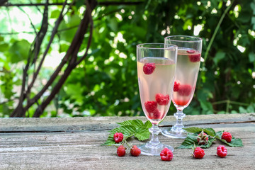 White wine with fresh raspberries. raspberry cocktail