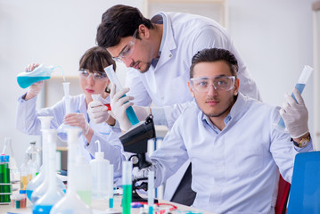 Team of chemists working in the lab