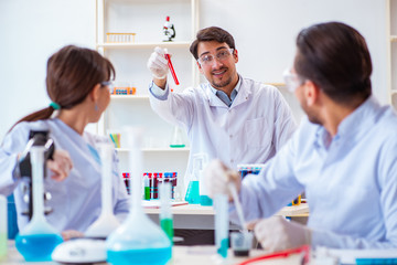 Team of chemists working in the lab